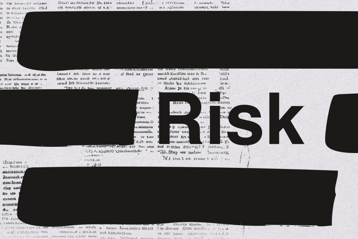 A document with large sections of black redacted text and the word "Risk" in bold text.