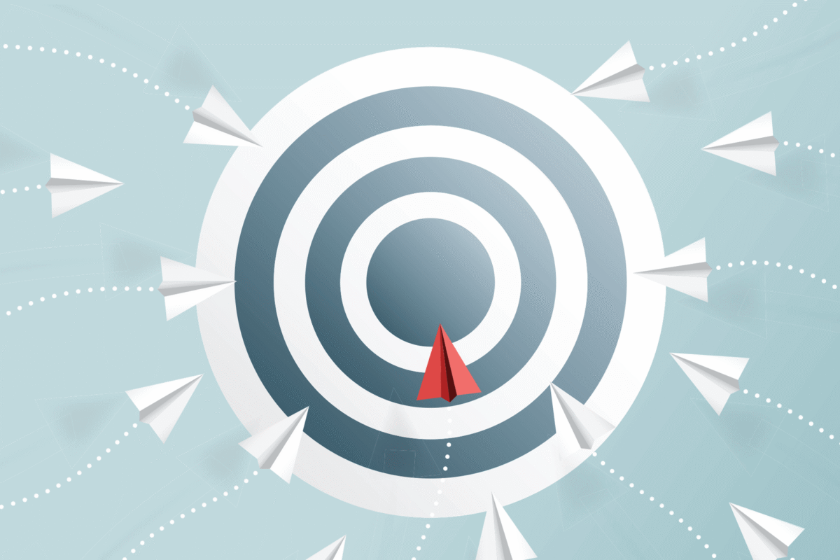 Illustration of a red paper airplane flying toward the center of a concentric target while multiple white paper airplanes approach from different directions in the background.
