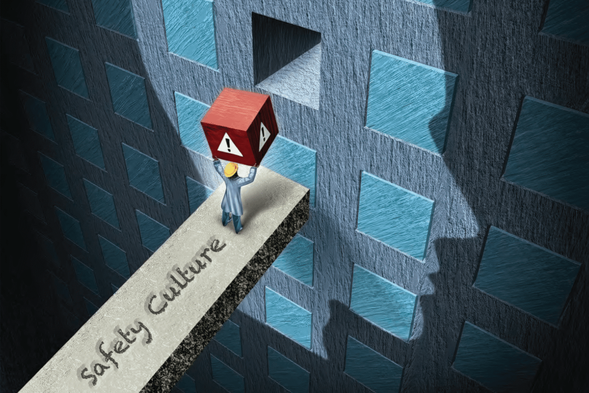 Illustration of a worker carrying a red warning cube along a platform labeled "Safety Culture."